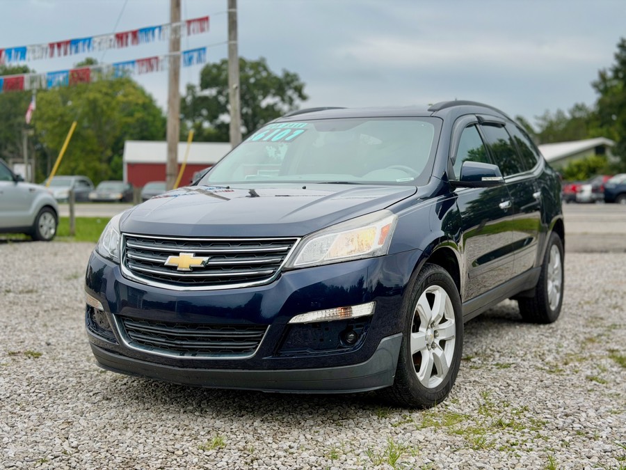 Navy blue Chevrolet Traverse LT AWD, front three-quarter with for-sale price sticker